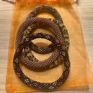 Set of 4 original Sashka beaded bracelets sent in organza bag.